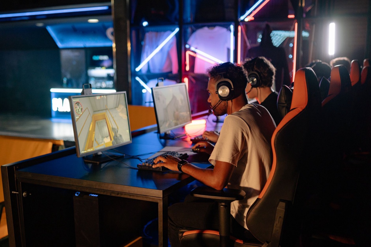 Indonesian gamer with smartphone and gaming headset