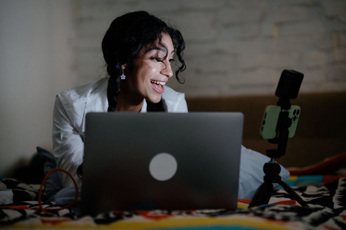 Indonesian influencer with laptop in studio