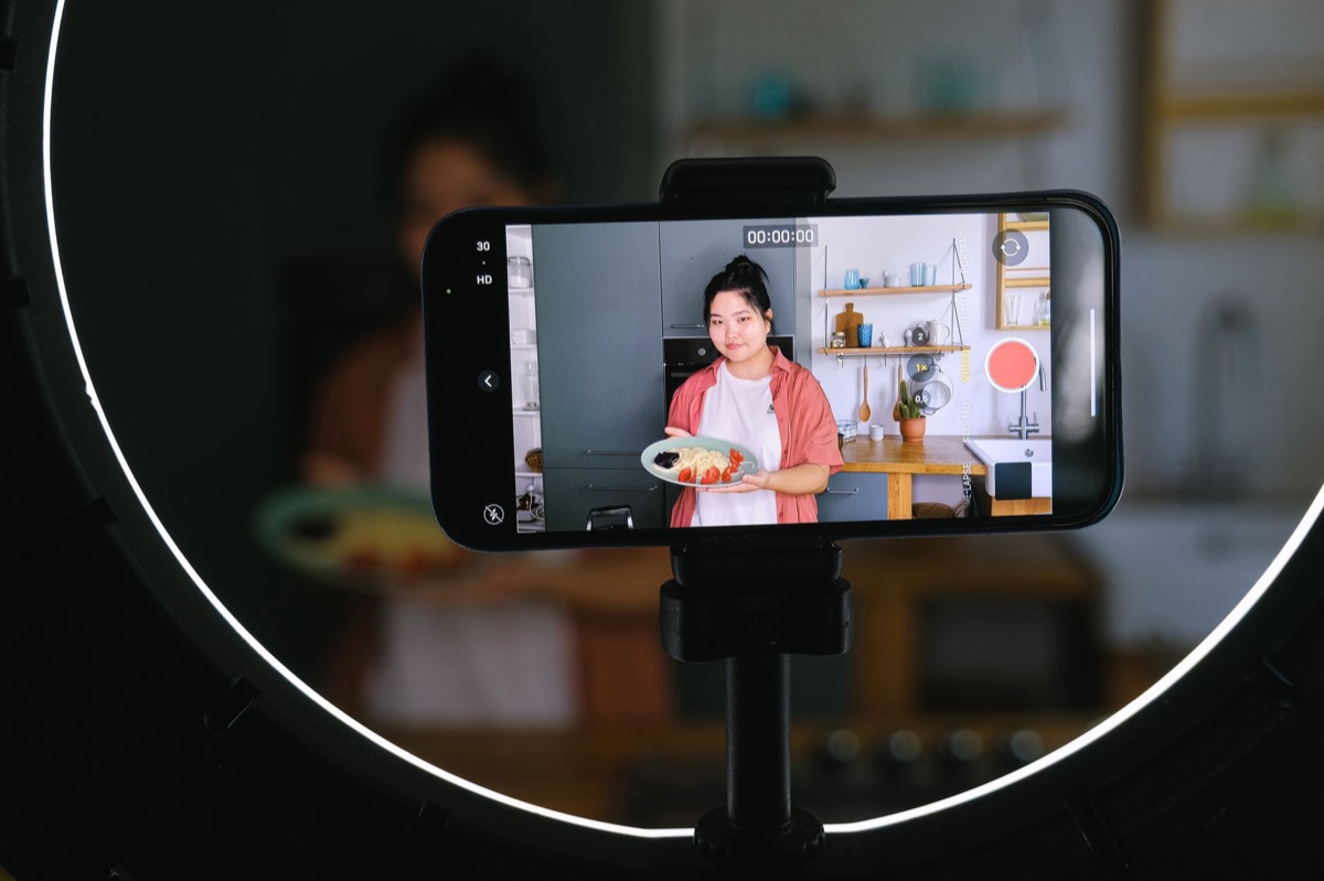 Indonesian influencer on smartphone
