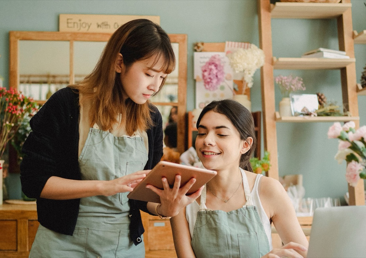 Indonesian influencer with tablet and laptop