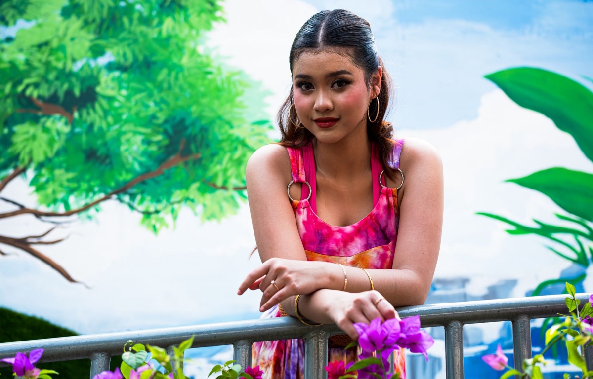 Indonesian influencer with natural hair and casual outfit
