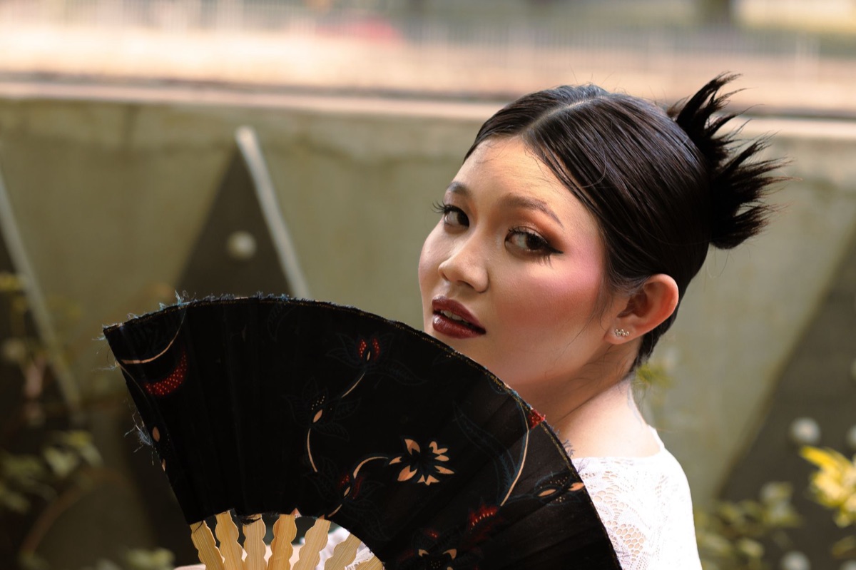 Indonesian model with branded logo and fan merchandise