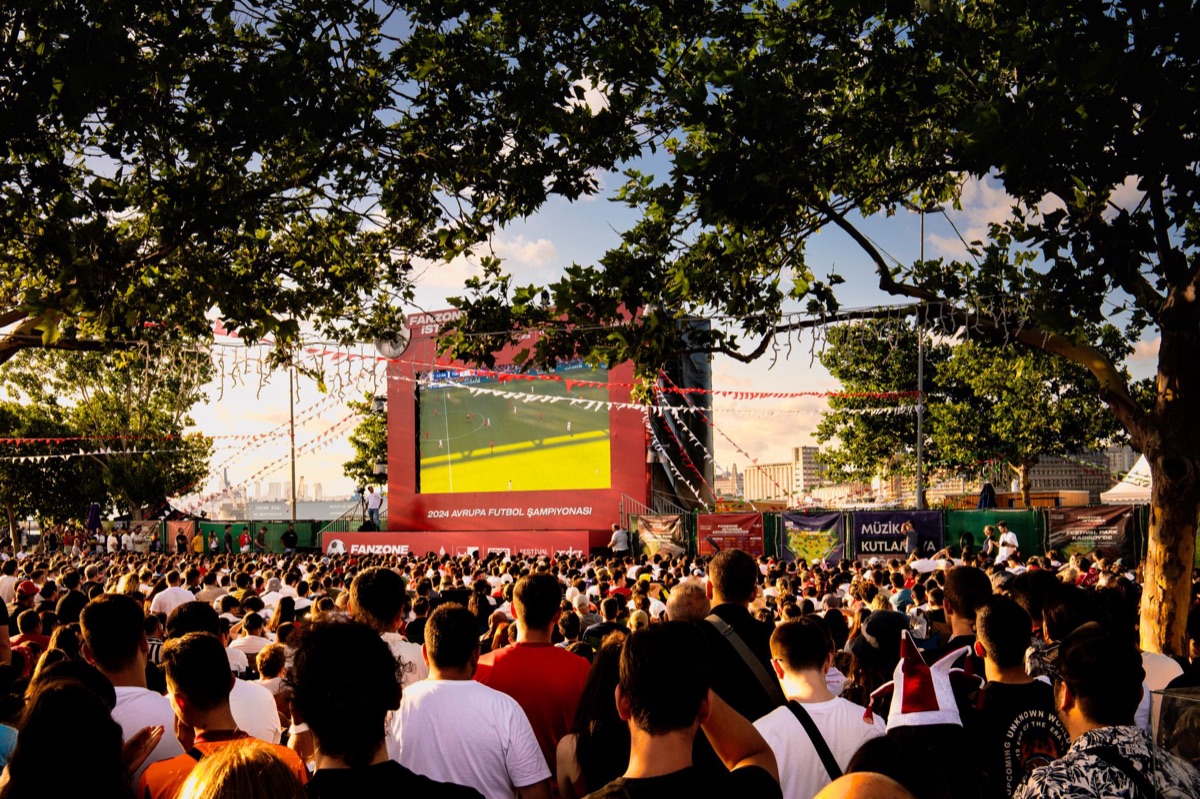 Indonesian fan gathering in outdoor space